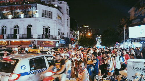 Crowd in city at night