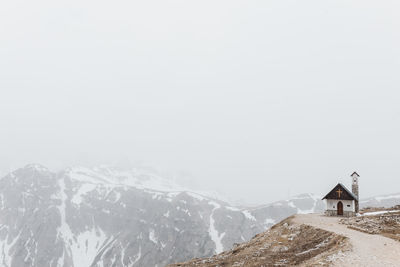 Scenic view of mountains against clear sky during winter