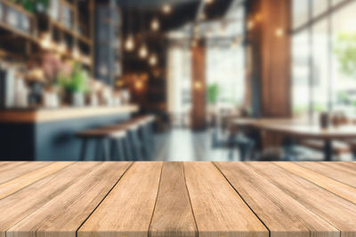 Close-up of wooden table in restaurant