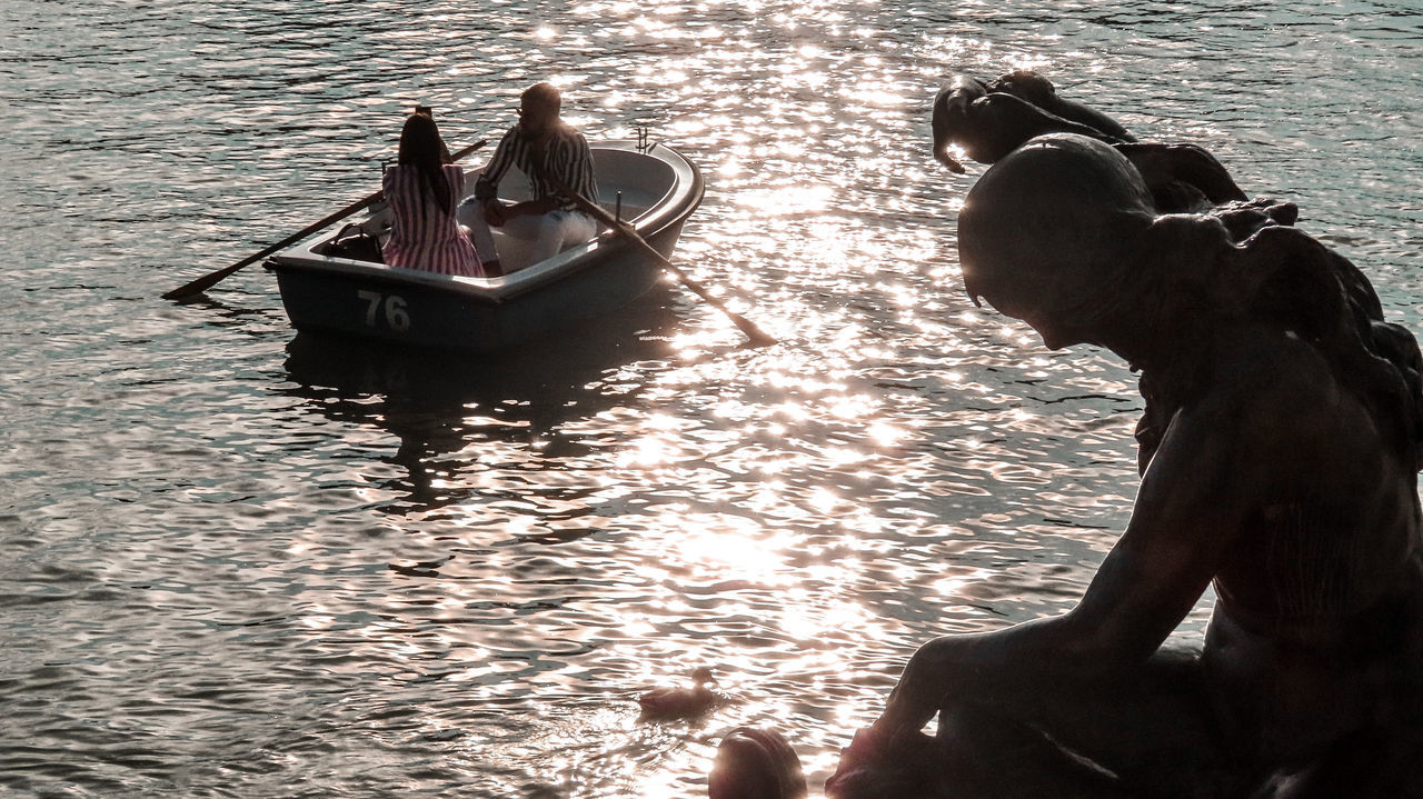 water, nautical vessel, transportation, nature, men, mode of transportation, adult, two people, sea, vehicle, outdoors, boat, day, sunlight, travel, lifestyles, person, sitting, leisure activity, women, togetherness, high angle view, rippled