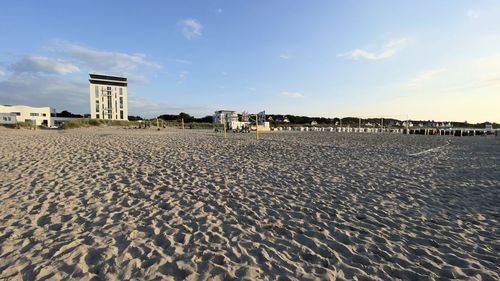 View of beach against buildings in city