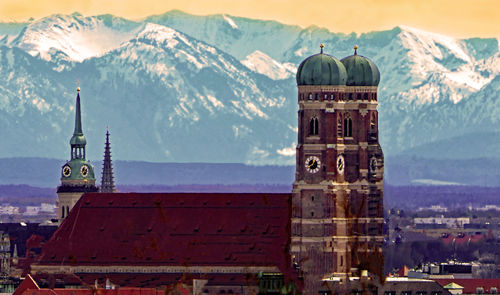 View of church and buildings against sky