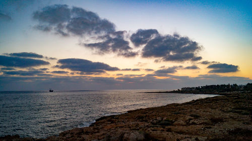 Scenic view of sea against sky at sunset