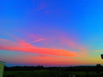 Scenic view of landscape at sunset