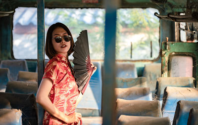 Portrait of young woman wearing sunglasses