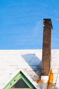 Low angle view of built structure against blue sky