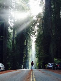 Woman walking on road