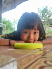 Portrait of cute boy with baby girl on table