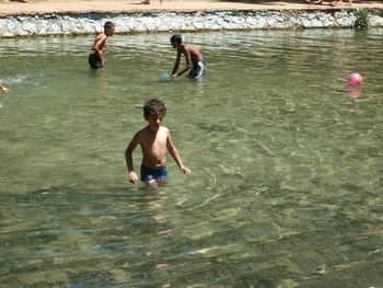 High angle view of children playing in water