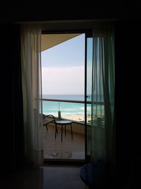 Scenic view of sea seen through window