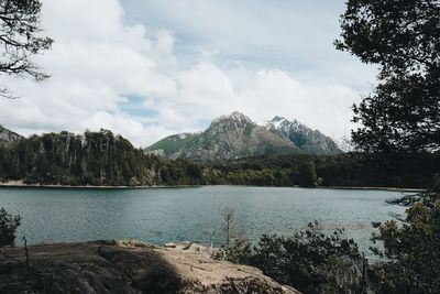 Scenic view of lake against cloudy sky