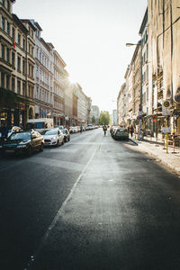 Vehicles on road along buildings