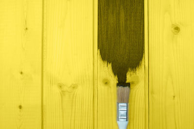 Full frame shot of person standing on wooden door