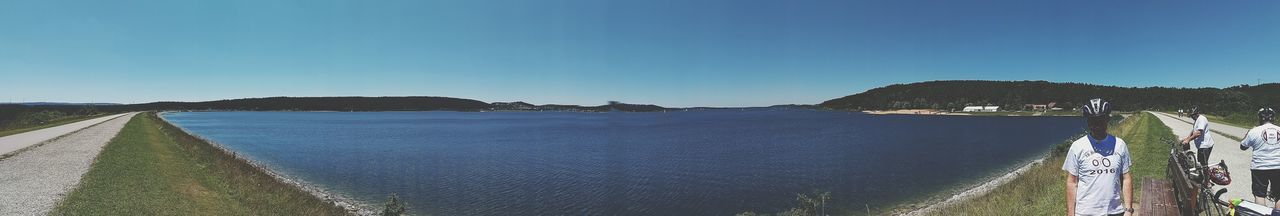 View of calm sea against clear blue sky