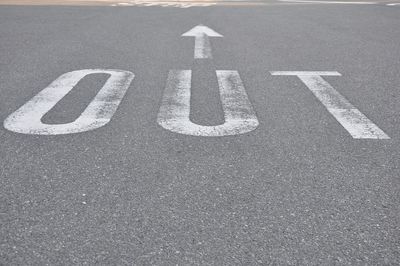 High angle view of arrow sign on road