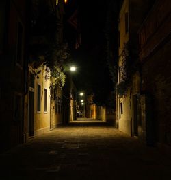 Narrow street in city at night