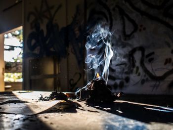 Close-up of burning candles in temple