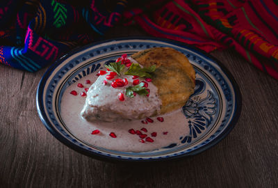 Chile en nogada on a talavera plate from puebla, traditional cuisine of mexico