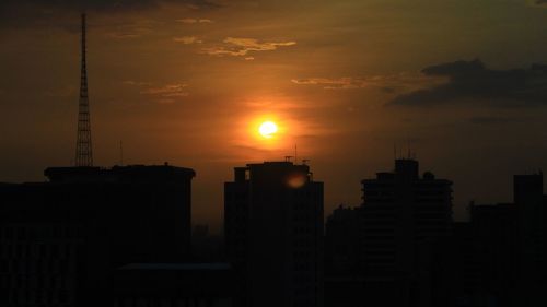 Silhouette of city at sunset