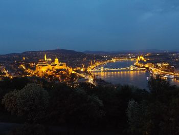 High angle view of chain bridge and cityscape at night