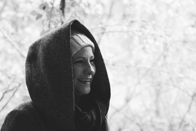 Portrait of smiling young woman in snow