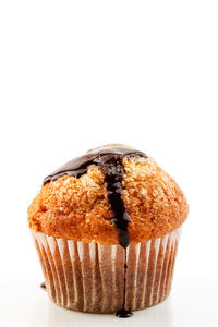 Close-up of cake against white background