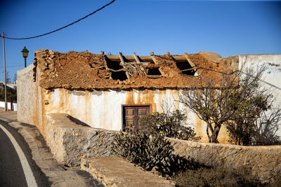 Low angle view of old ruins against clear sky