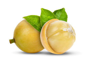 Close-up of lemon against white background