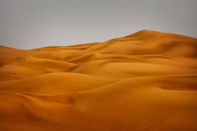 Scenic view of desert against clear sky