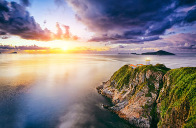 Scenic view of sea against sky at sunset