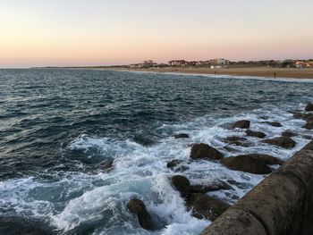 Scenic view of sea at sunset