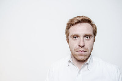 Portrait of man against white background