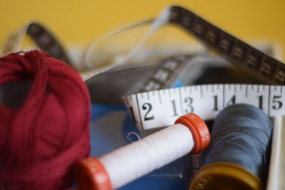 Close-up of measuring tape and thread