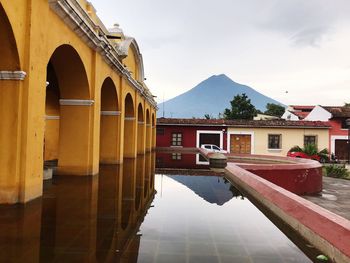 Reflection of buildings on mountain