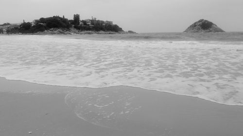 Scenic view of sea against sky during winter