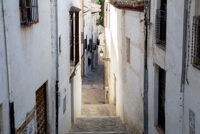 Narrow alley amidst buildings in city