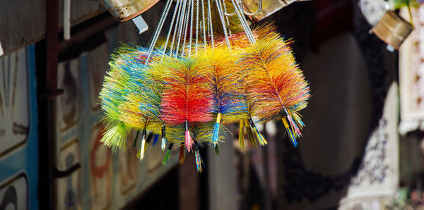 Close-up of multi colored decoration hanging on wood