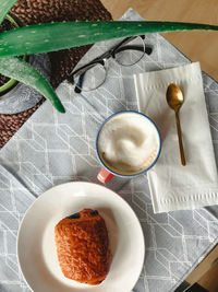 High angle view of coffee in cup on table