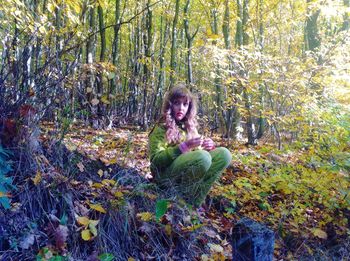 Girl sitting in forest