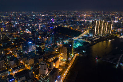 High angle view of illuminated buildings in city at night