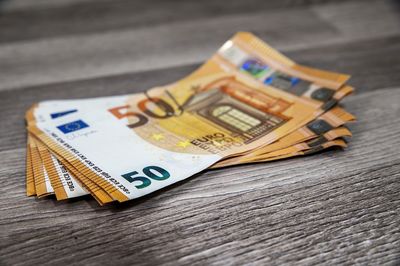 Close-up of paper currencies on table