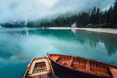 Scenic view of lake by mountains against sky