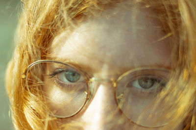 Close-up portrait of woman wearing eyeglasses