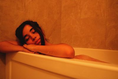 Portrait of woman relaxing in bathroom