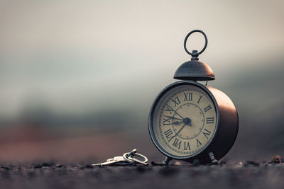 Close-up of clock on table