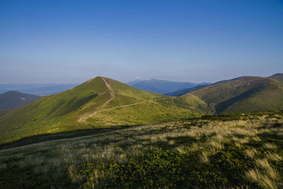 Scenic view of mountain range against sky