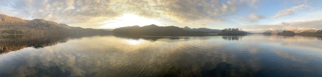 Panoramic view of lake against sky during sunset