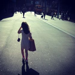 People walking on road in city