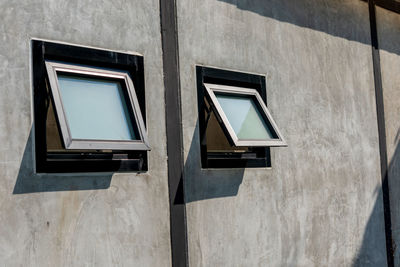 Low angle view of window on wall