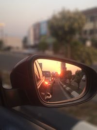 Close-up of side-view mirror of car